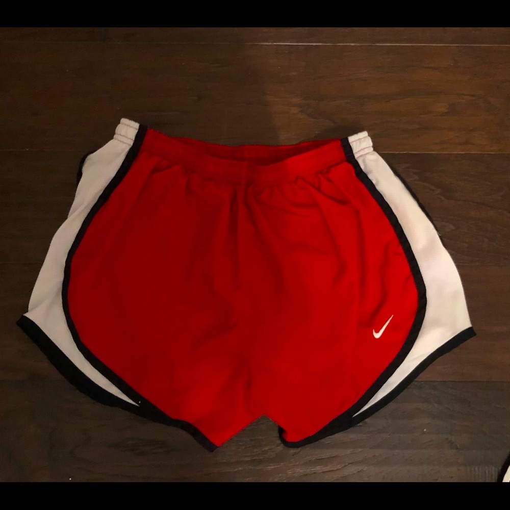 Nike DRI-FIT red and white shorts.